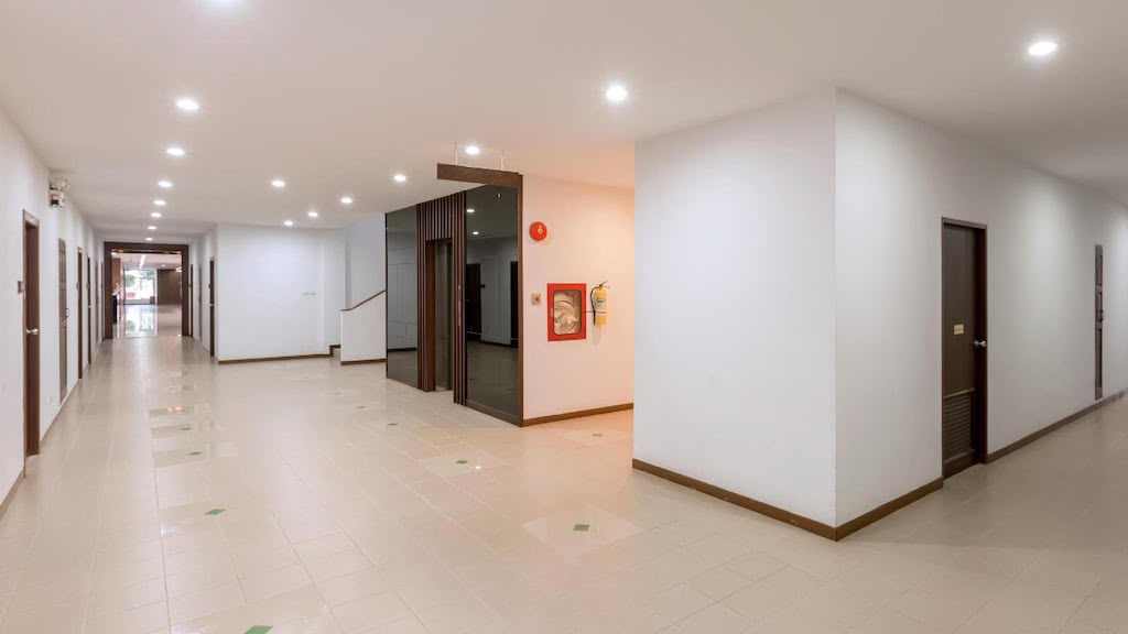 Hotel hallway leading to guest rooms
