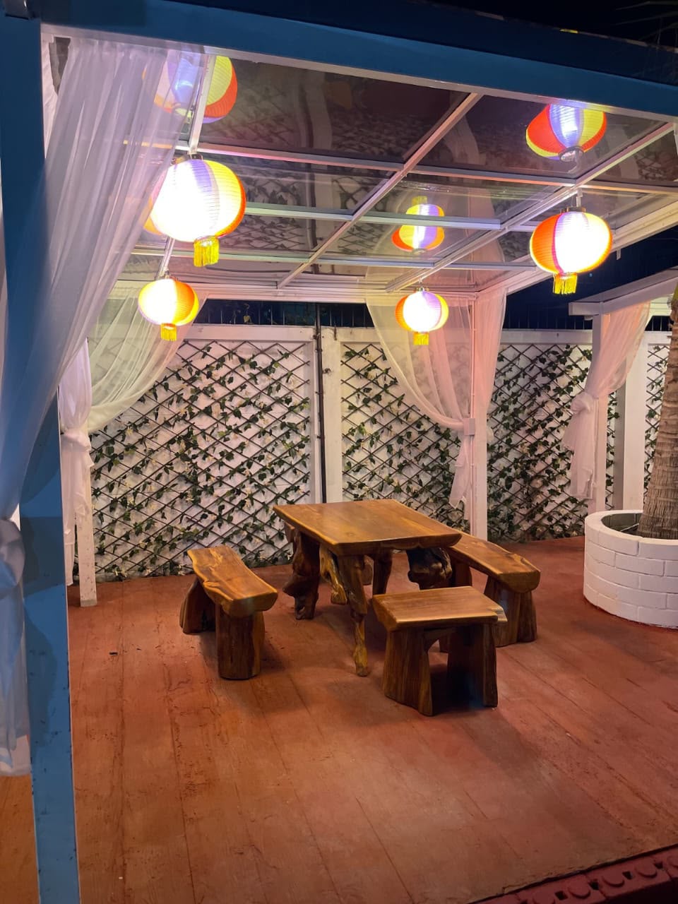 Pool cabana area at night — ambient lighting